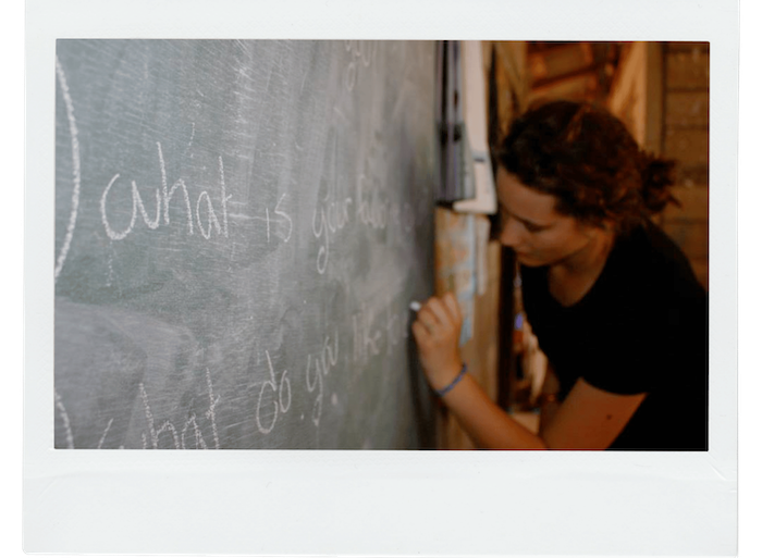 picture of me drawing on a blackboard in Thailand